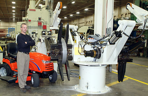 Simplicity Manufacturing, Inc., a leading manufacturer of premium quality lawn and garden tractors. Standing with their Cooper Weymouth Petersen (CWP<sup>©</sup>) coil handling system.